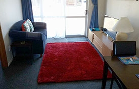 img_48570_11 a set of single bunk beds in the lounge of family unit